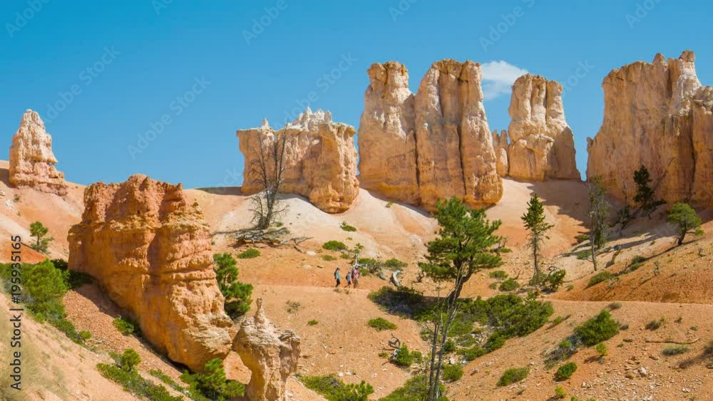People walking along the trail. Sunny day in the Bryce Canyon National Park. Nature video. Amazing mountain landscape. Spectacular view at the cliffs. Nature video. Utah. USA. 4K, high bit rate, UHD People walking along the trail. Sunny day in the Bryce Canyon National Park. Nature video. Amazing mountain landscape. Spectacular view at the cliffs. Nature video. Utah. USA. 4K, high bit rate, UHD