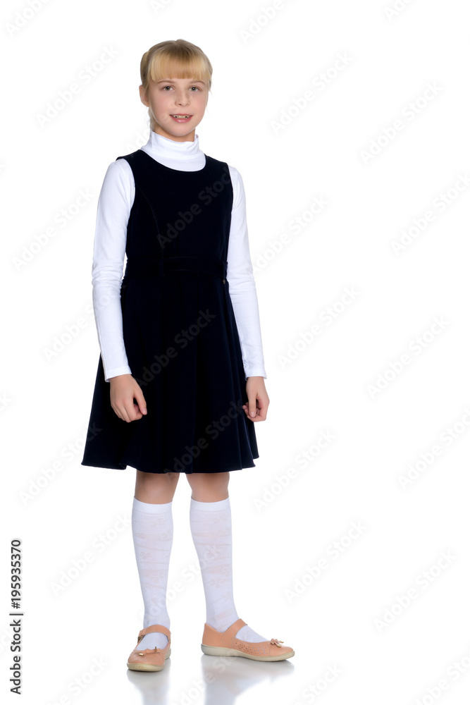 Beautiful little girl in a school uniform. Beautiful little girl in a school uniform.