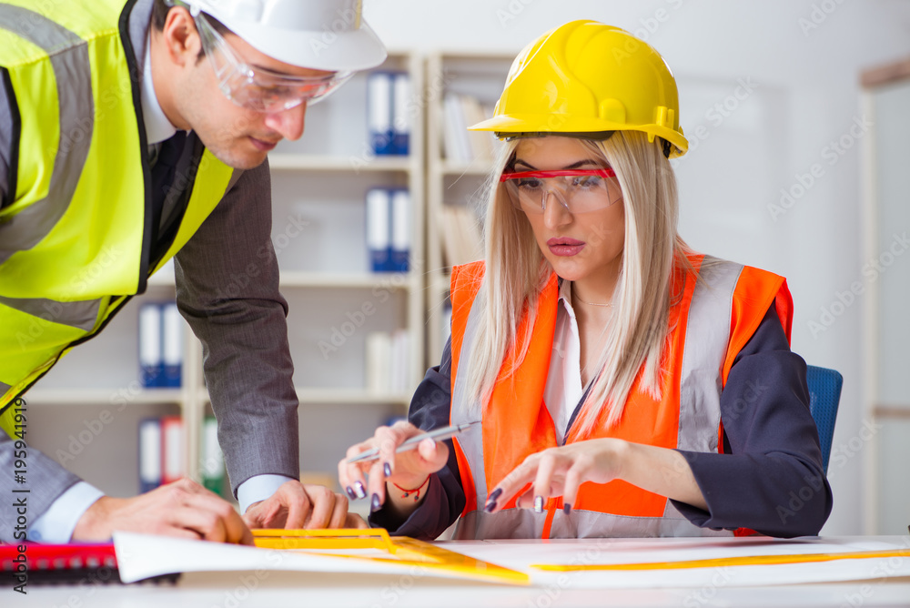 Construction workers having discussion in office before starting Construction workers having discussion in office before starting