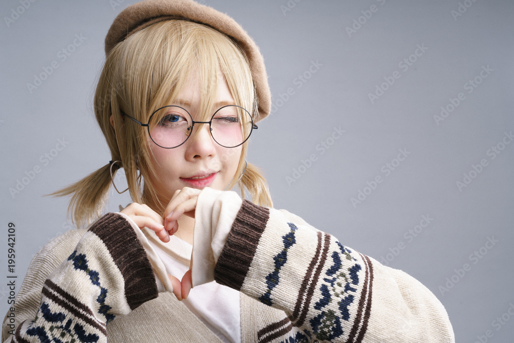 Charming Asian girl with glasses, blonde hair wig and big eyes 