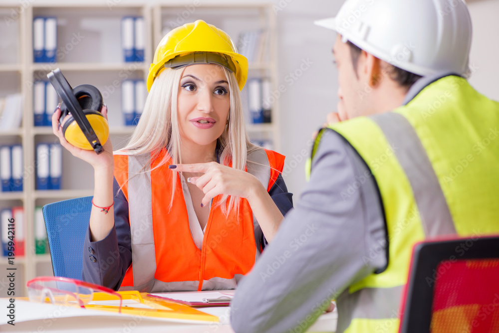 Construction workers having discussion in office before starting Construction workers having discussion in office before starting
