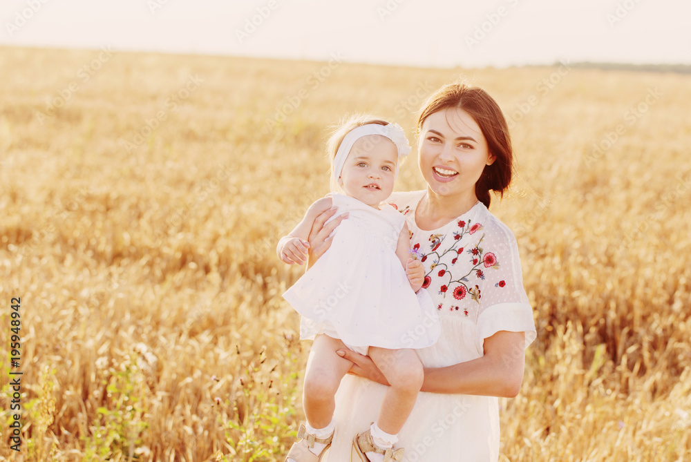 mother and daugther in field