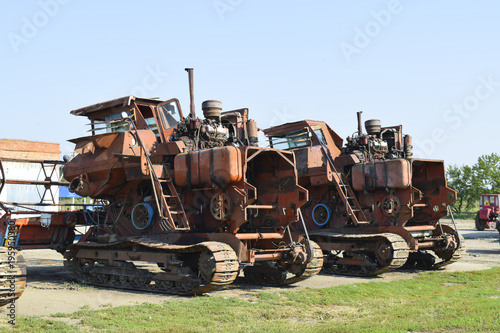 Old rusty disassembled combine harvester. photo