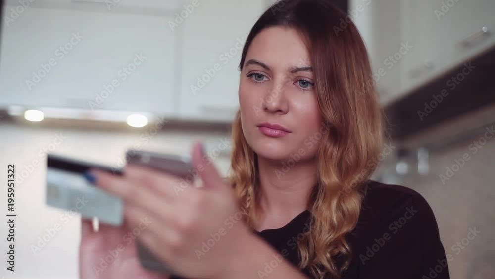 Beautiful woman online banking using smartphone shopping online with credit card at home lifestyle. Beautiful woman online banking using smartphone shopping online with credit card at home lifestyle.