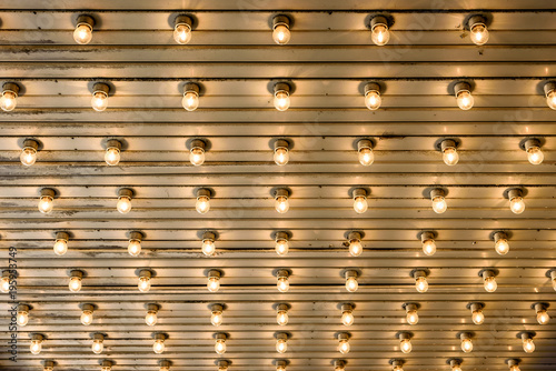 Rows of illuminated globes under the marquee as often used at entrance to theatres and casinos
 photo