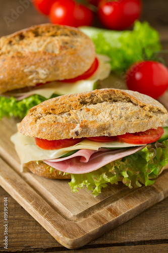 Wholegrain Ciabatta Sandwich with Lettuce, Tomatoes, Ham and Cheese