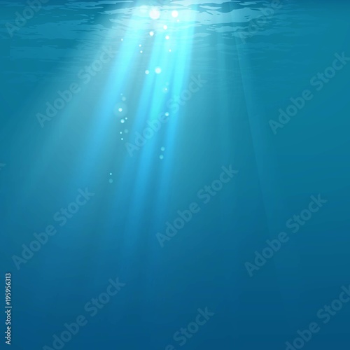 Light in water. Rays of light against the background of water