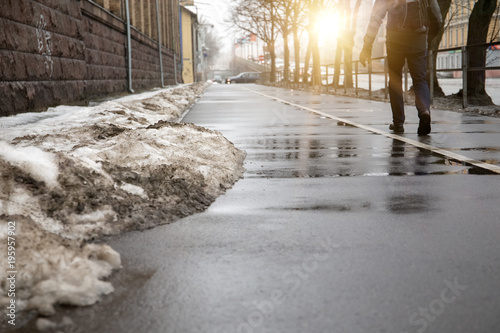 melting snow in the city streets. spring background © STOATPHOTO