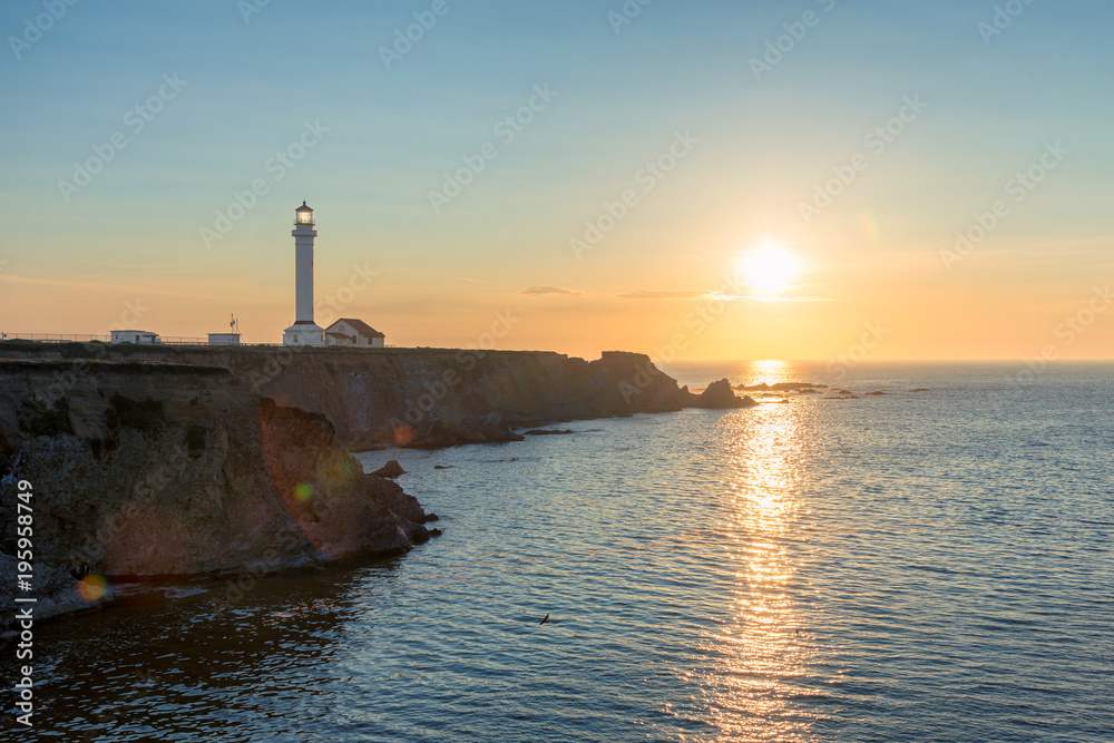 Point Arena Lighthouse at sunset in Mendocino County, Northern California Coast. 