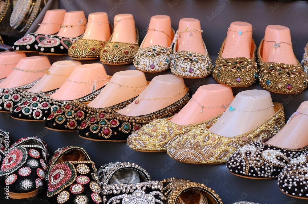 Traditional decorated Arabian shoes for women at the market in Dubai. Stock  Photo | Adobe Stock