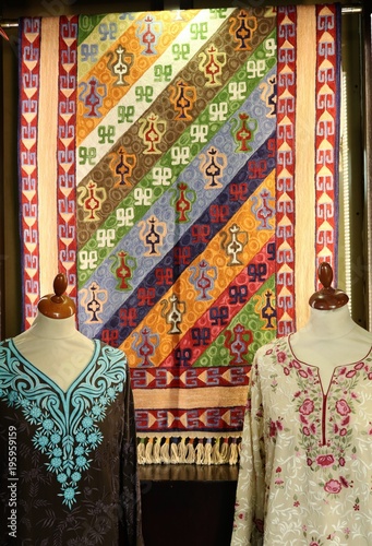 Fabric with oriental ornaments. Multicolored textiles in the bazaar in Dubai.
