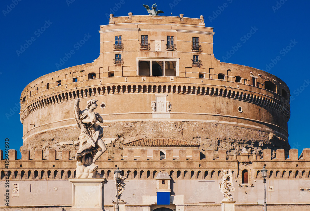 The statues on the Sant' Angelo Bridge in front of Sant' Angelo Castle in Rome, Italy