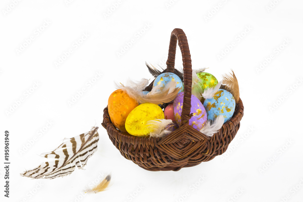 basket with Easter eggs on a white background