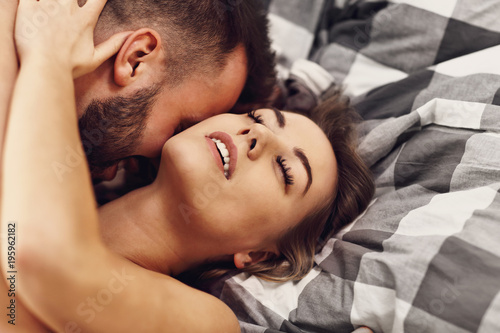 Obraz na plátně Sexy young lovers being intimate in bed