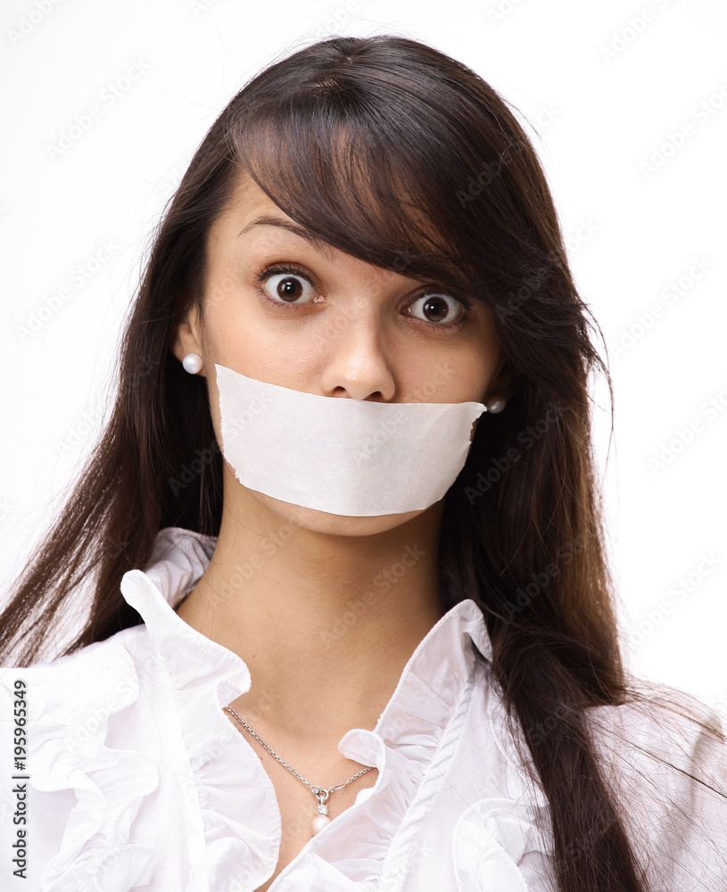 portrait of young business woman with taped mouth portrait of young business woman with taped mouth