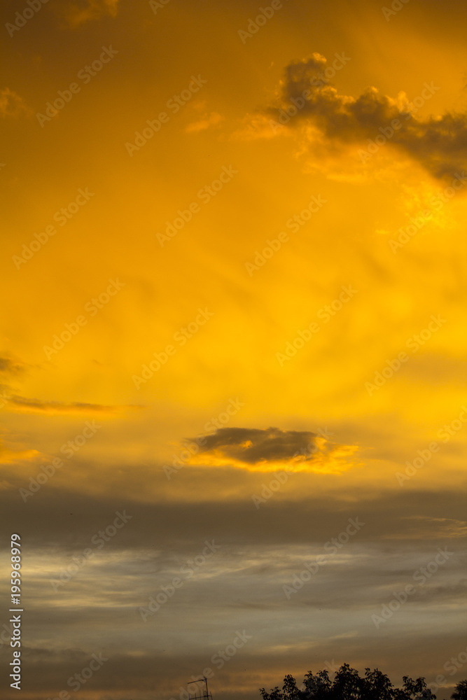 The sky after a summer thunderstorm. Orange cumulus clouds. Sunset. .Thunder Sky