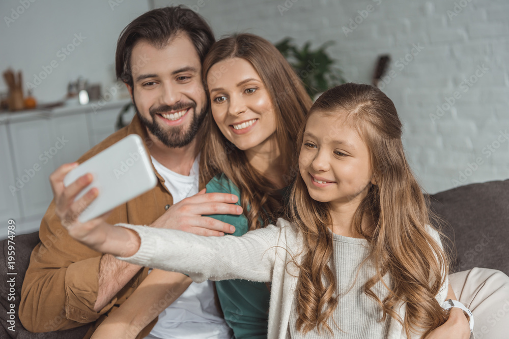 happy family taking selfie with smartphone happy family taking selfie with smartphone