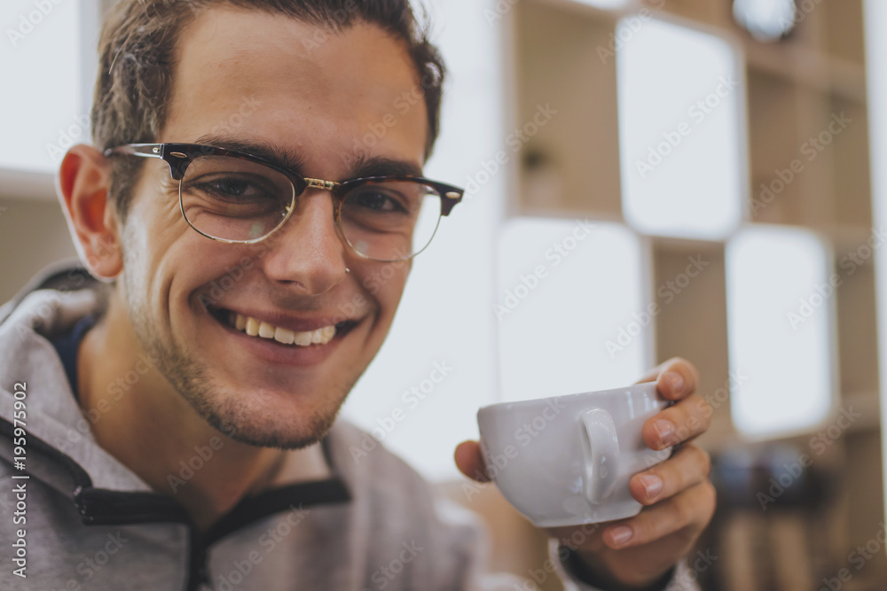 portrait of trendy young man taking coffee portrait of trendy young man taking coffee