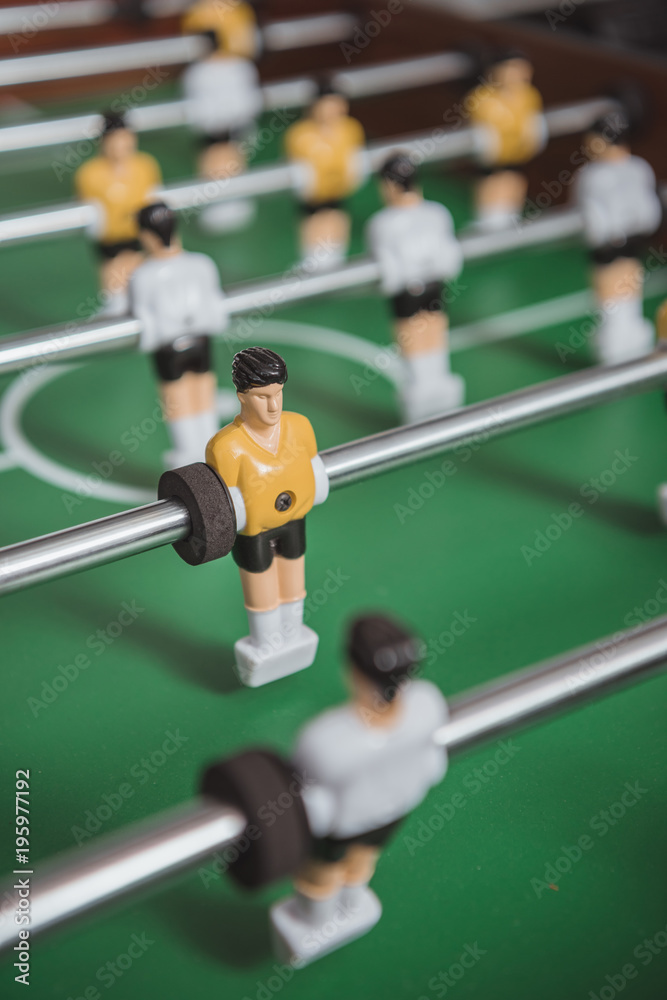 Fototapeta premium close up of table soccer with football players silhouettes