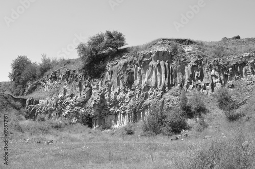 Basalt columns rocks in Racos, Transylvania. They are volcanic rock outcrops in the form of columnar basalt located in Racos, Romania
 photo