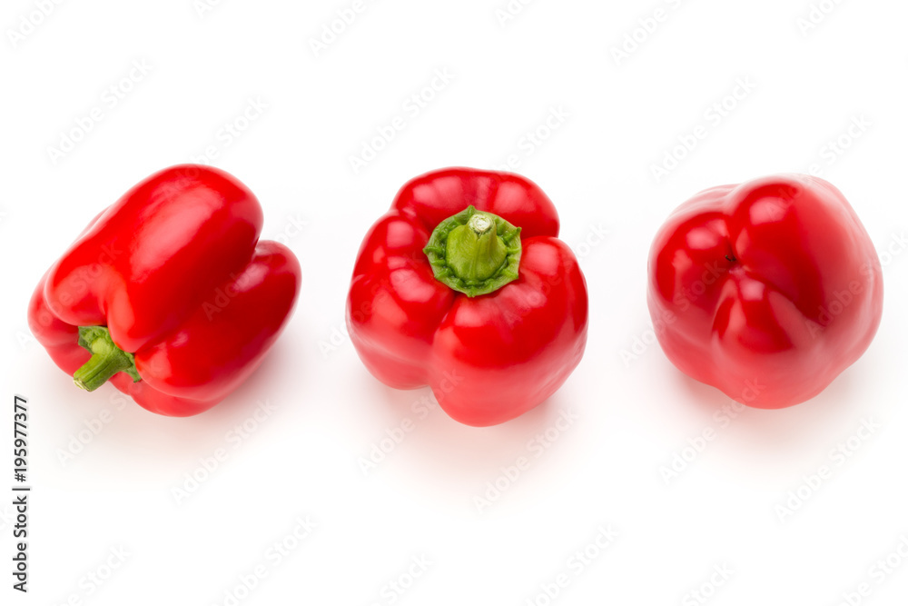 Red bell pepper with half and leaves isolated on white. Red bell pepper with half and leaves isolated on white.