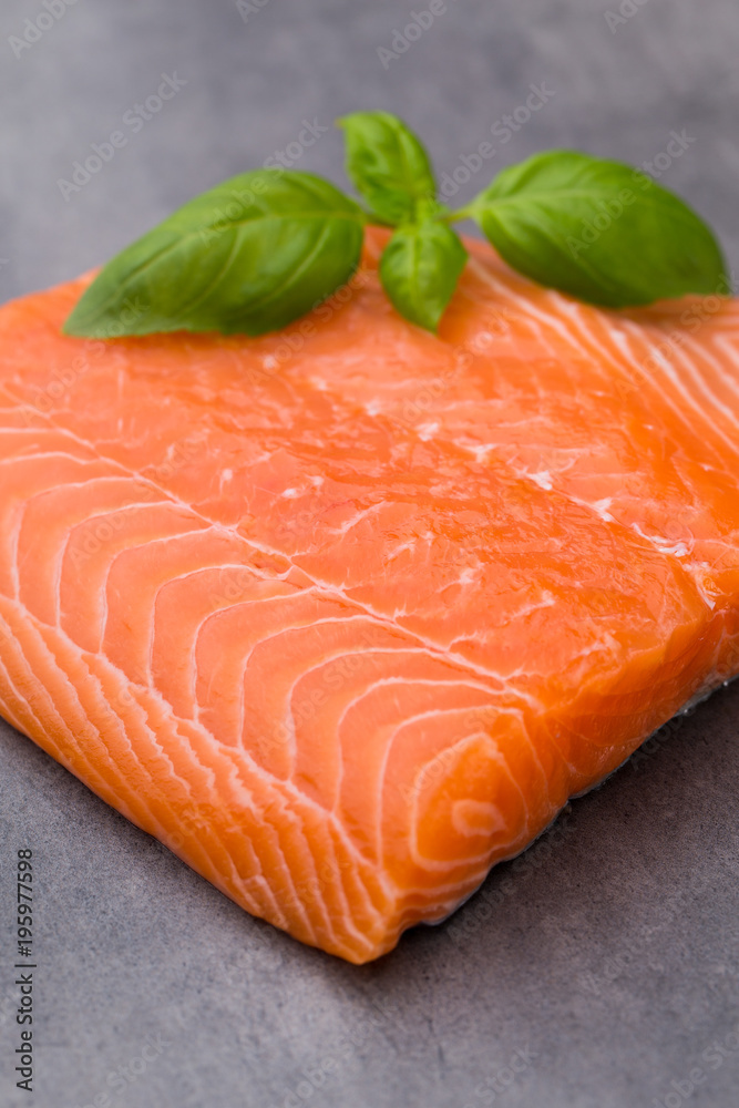 Fresh salmon fille with spice on the grey background. Fresh salmon fille with spice on the grey background.