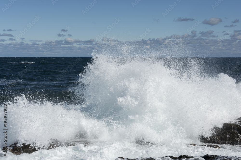 Waves that break into the rocks