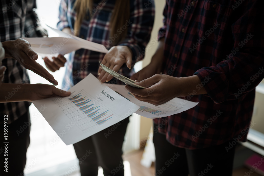 Fototapeta premium A group of people working man and woman in the plaid shirt Talking/consulting/idea about doing business/Profit Business Benefits. teamwork business meeting .