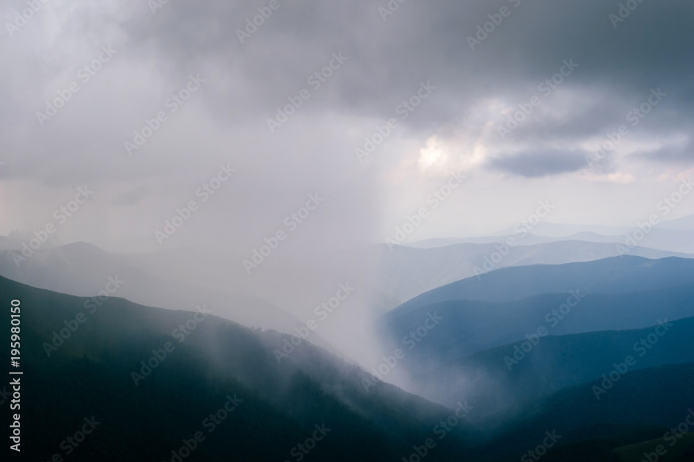 Storm rainy clouds above mountains. Apocalypse fantasy fabulous sky. Beautiful windy dramatic cloudscape at nature. Picturesque scenic view outdoor. Travel in wild territory. Discover rocky hills.