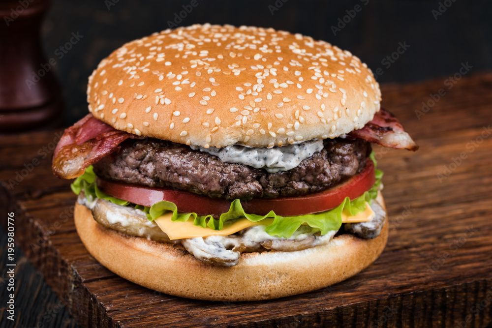 Burger on a wooden board Burger on a wooden board