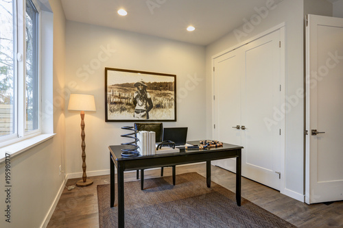 Modern home office design with black wood table