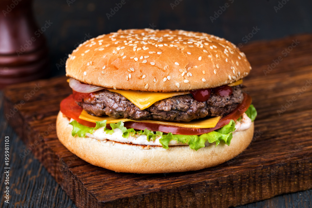 Burger on a wooden board Burger on a wooden board