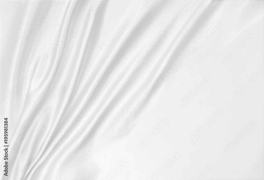 Smooth elegant white silk or satin luxury cloth texture as wedding background. Luxurious background design