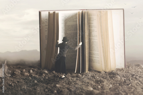 Foto surreal image of a curious woman leafing through a giant book