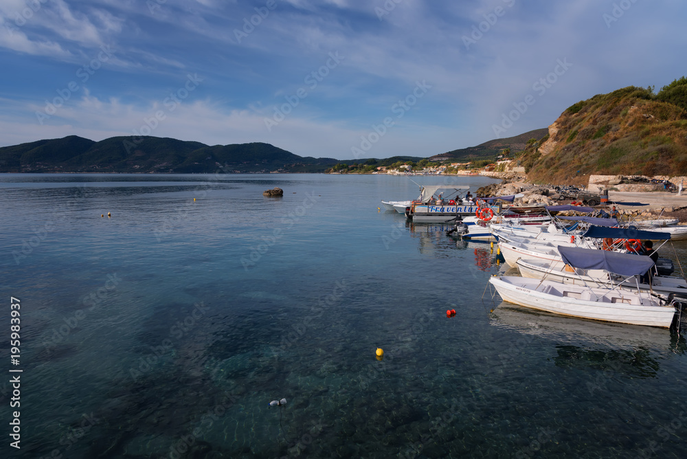 Agios Sostis, Zakynthos Island, Greece – September 24, 2017: Boats in Laganas harbor on a summer cloudy day.