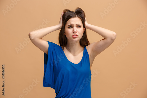 Beautiful woman in stress isolated on pastel