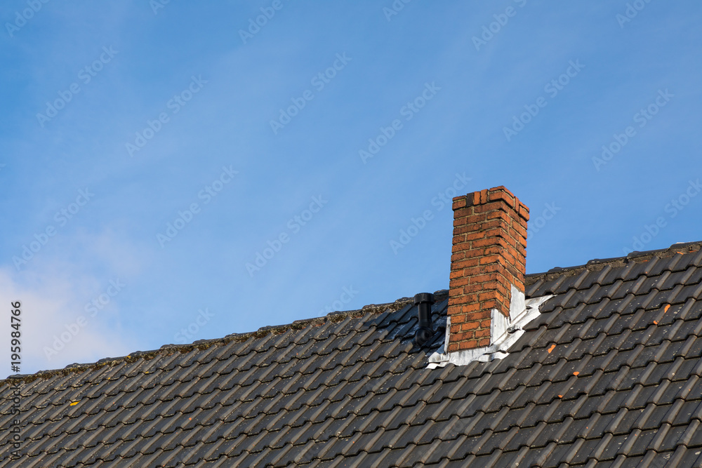 chimney roof house with blue sky
