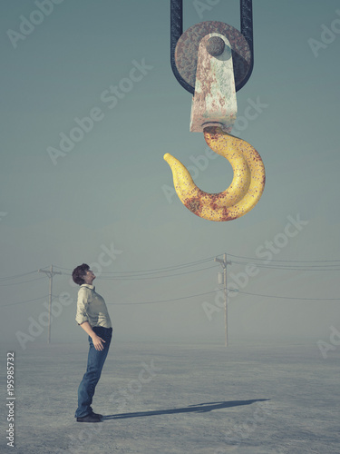 Man looking at a crane hook