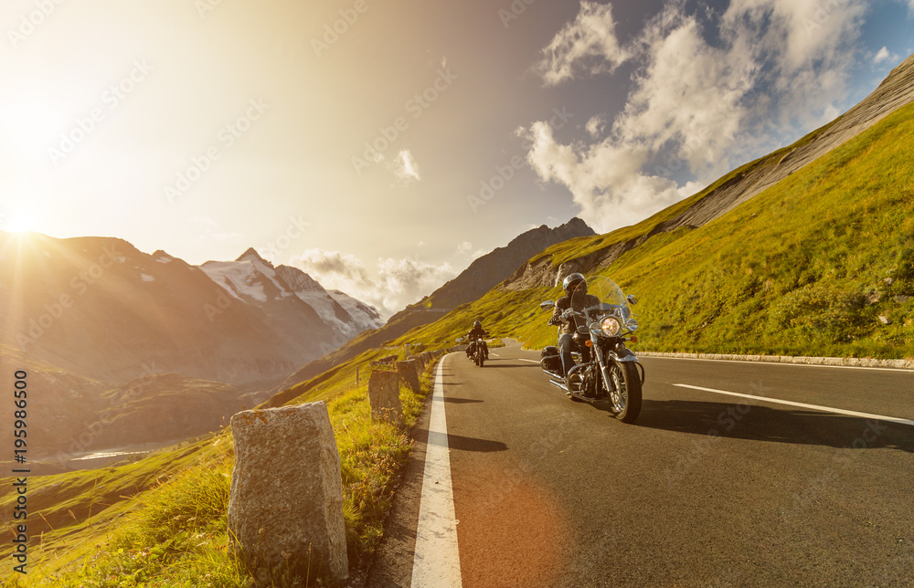Fototapeta premium Motorcycle drivers riding in Alpine highway on famous Hochalpenstrasse, Austria, Europe.