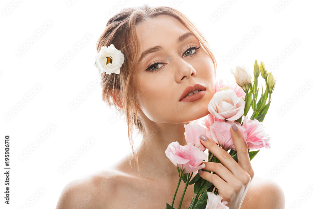 Picture of young woman 20s with brown hair in bun holding bunch of lovely lisianthus flowers, isolated over white background Picture of young woman 20s with brown hair in bun holding bunch of lovely lisianthus flowers, isolated over white background