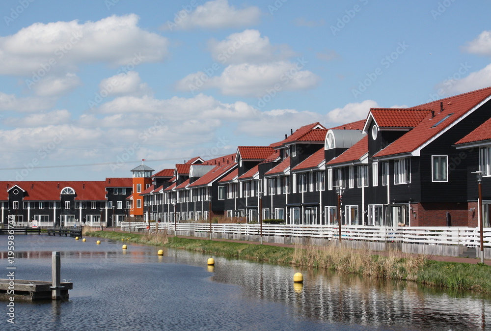 Obraz premium Pierhouses in the Reitdiephaven in the city of Groningen. The Netherlands