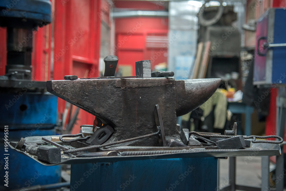 old anvil and various forging tools
