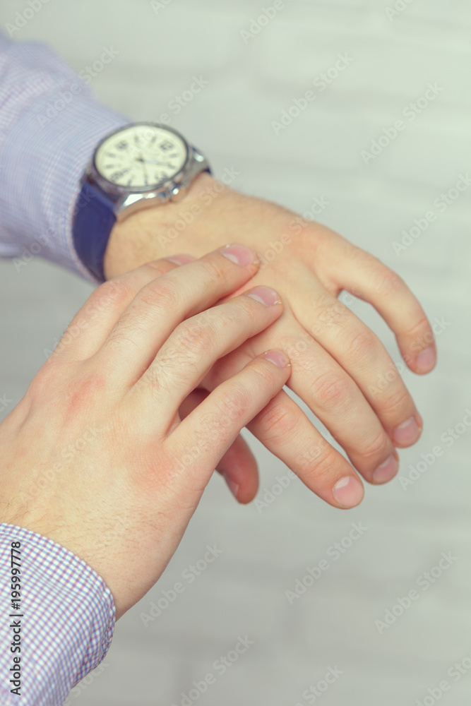 Man with clock checks the time
