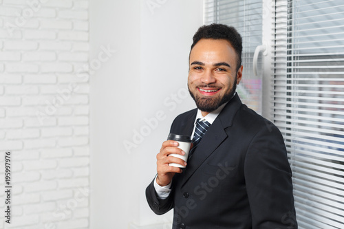 Business man in a business suit and a cup of coffee