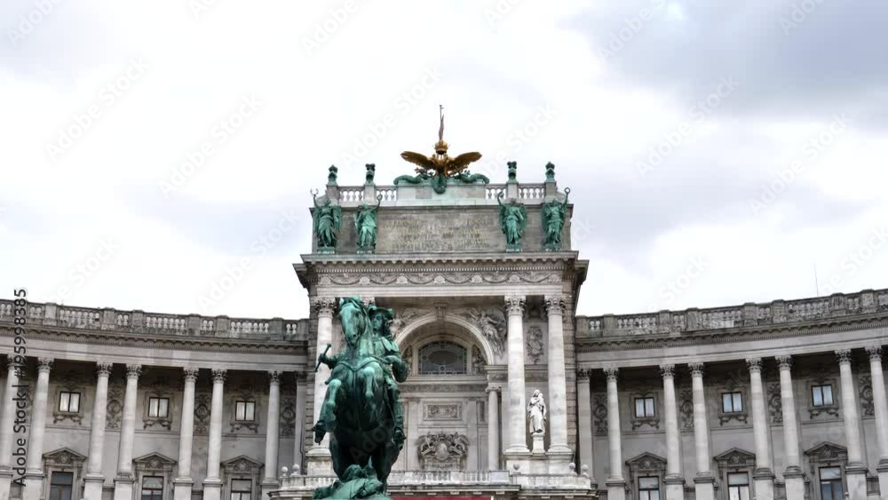 the front of hofburg palace and the prince eugene statue in vienna , austria the front of hofburg palace and the prince eugene statue in vienna , austria