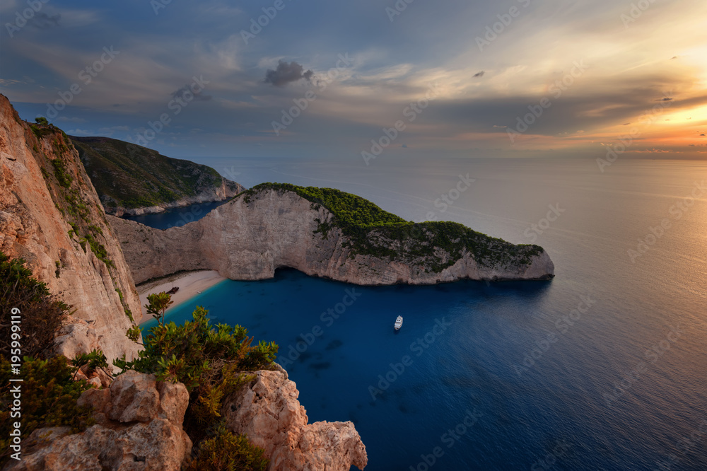 Ship Wreck beach and Navagio bay at sunset. The most famous natural landmark of Zakynthos, Greek island in the Ionian Sea.