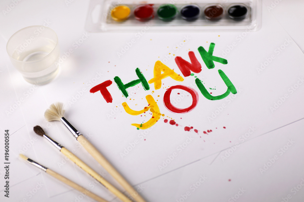 inscription on white sheet of paper with watercolors Thank you inscription on white sheet of paper with watercolors Thank you