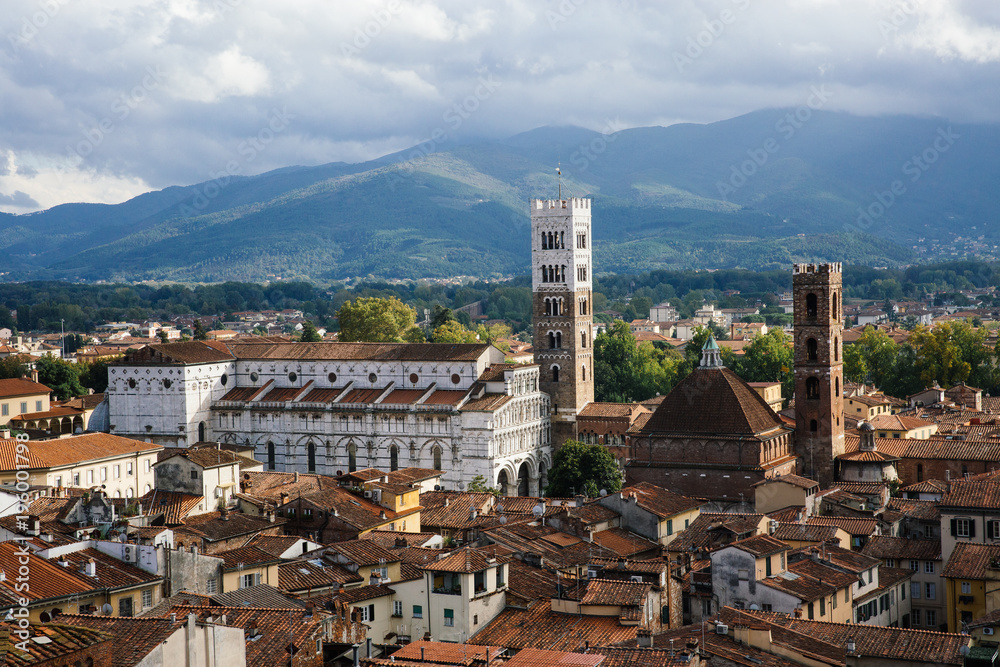 Scenic view of St. Martin Cathedral (Chiesa di San Martino) with bell tower from Torre delle Ore. Location Lucca, Tuscany, Italy. Picturesque travel postcard.