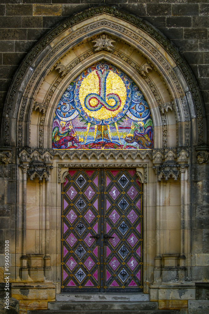Old doors in Catholic church Visegrad (Prague) in the Neo-Gothic style. The Basilica of Saints Peter and Paul (The Cathedral of St. Peter and Paul) .Czech Republic.