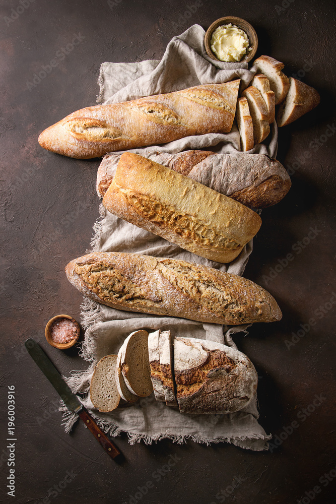 Variety of loafs fresh baked artisan rye, white and whole grain bread ...